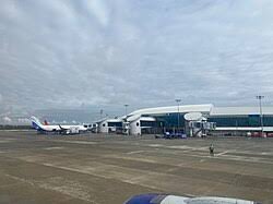 Exterior view of Srinagar Airport with mountains in the background